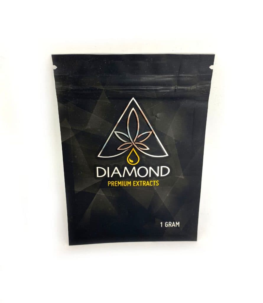 Diamond Premium Extracts blueberry strain-specific wax concentrate in small container, golden amber cannabis extract